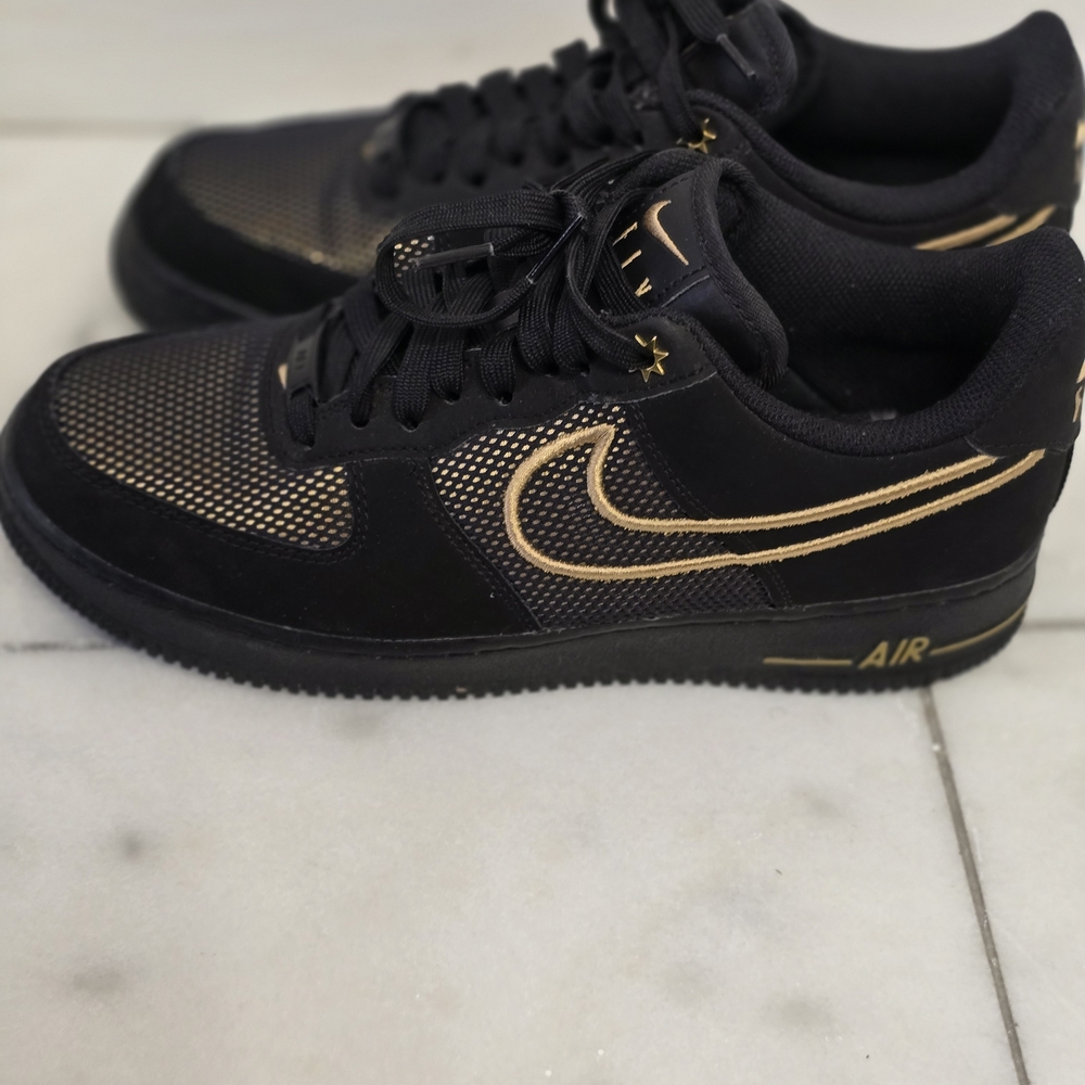 Black and Gold Nike Sneakers